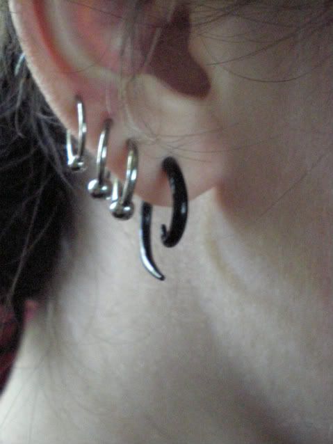  Both ears are the same. The bottom piercings are a tiny bit uneven, 